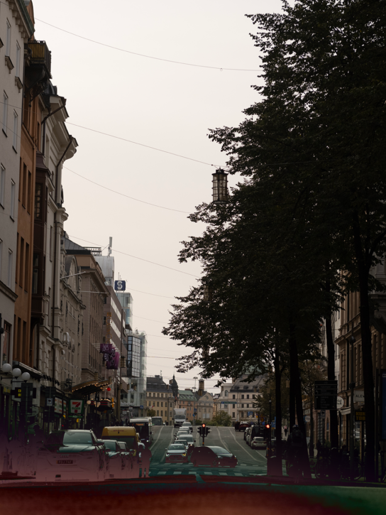 A street in Stockholm, the capital of Sweden, with buildings and cars.