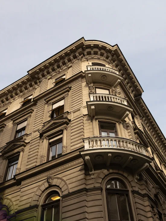A corner building with ornate architectural details and balconies.