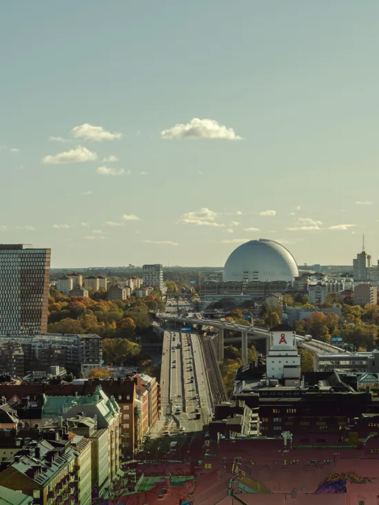 An aerial view of Stockholm cityscape with Avicii Arena in the background.