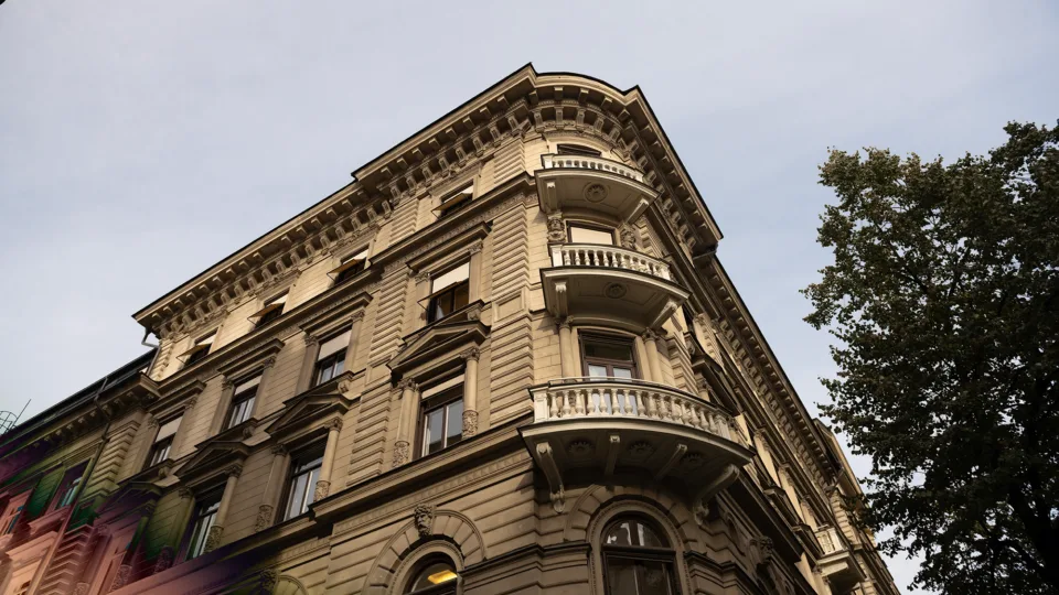 A corner building with ornate architectural details and balconies.